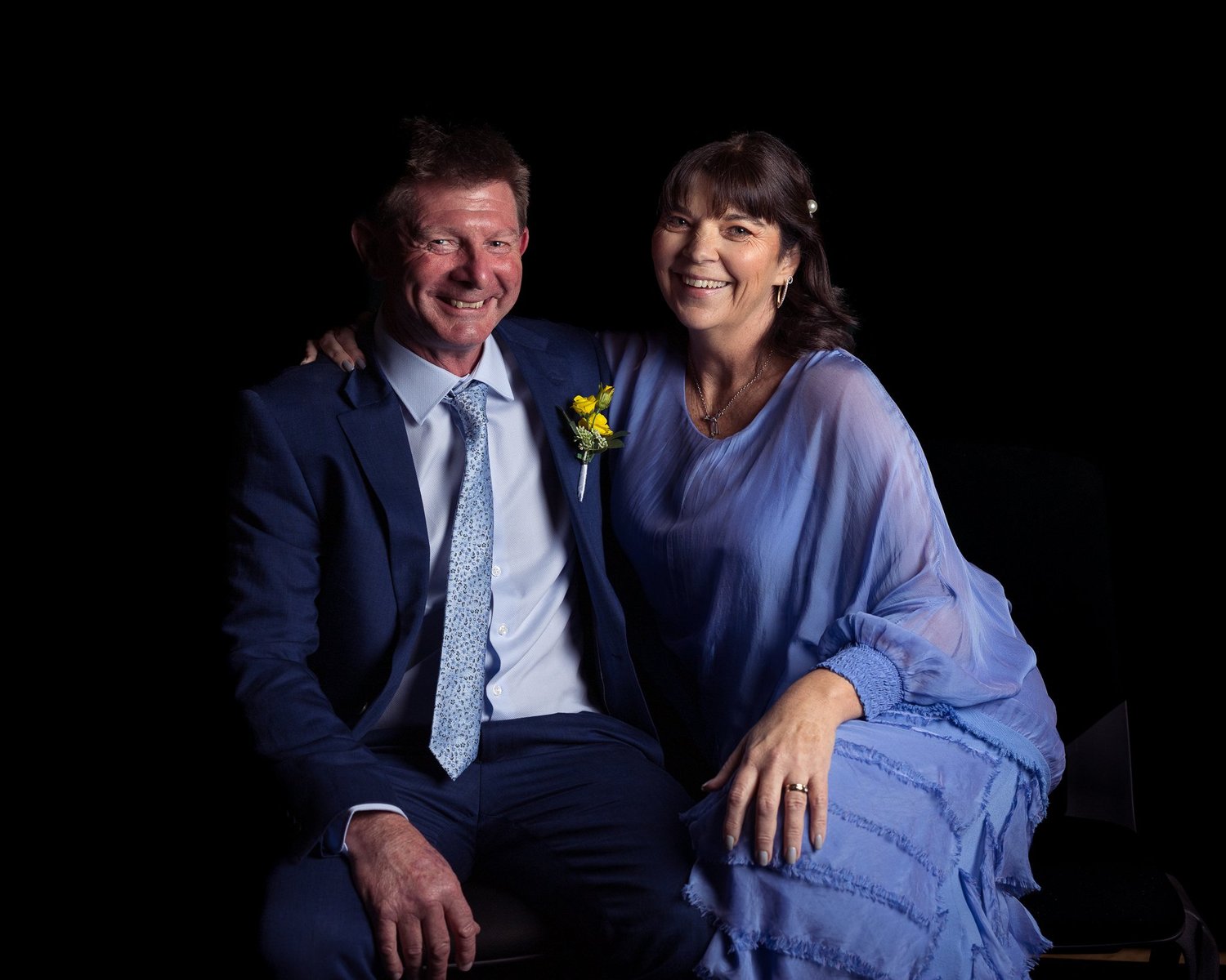 Two guests pose together for an evening portrait