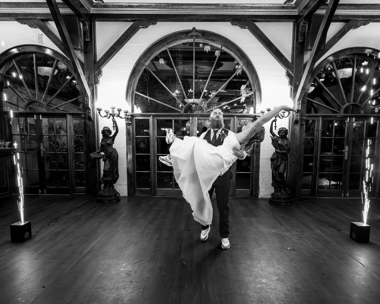 Black and white photo of Felicity and Ronan's first dance in the grand hall