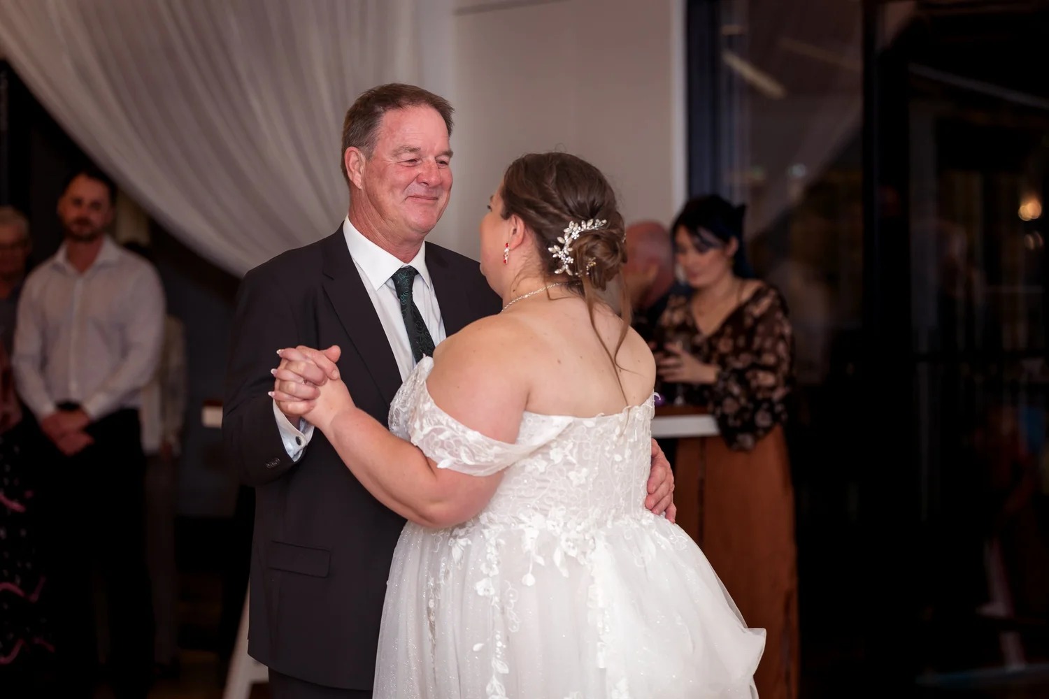 Rebecca dances with a guest at the reception