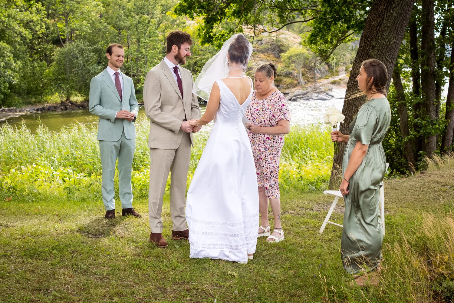 Sofia and John during their outdoor ceremony by the water