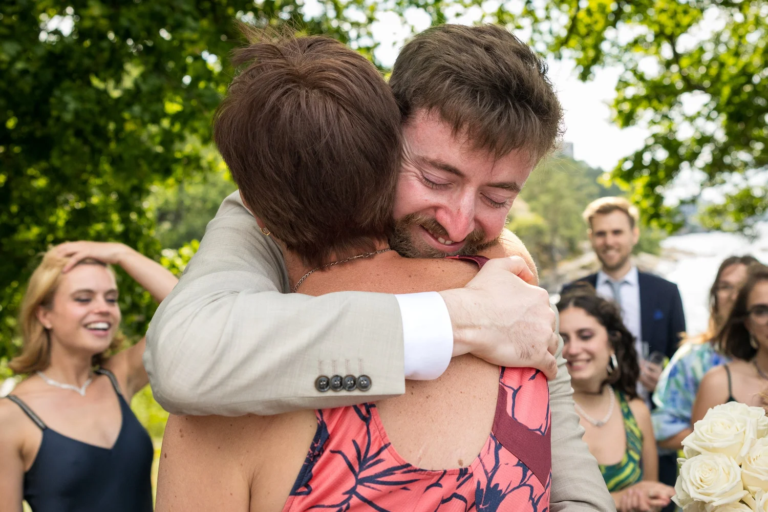 John hugs a guest after the ceremony