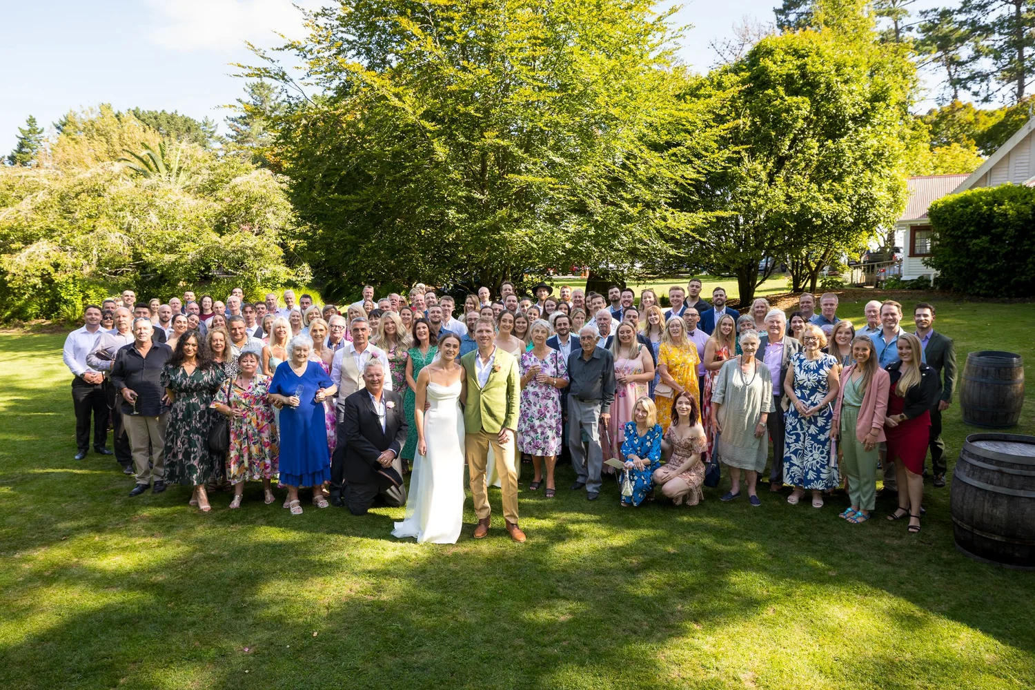 Jade and Ben with all their guests on the lawn