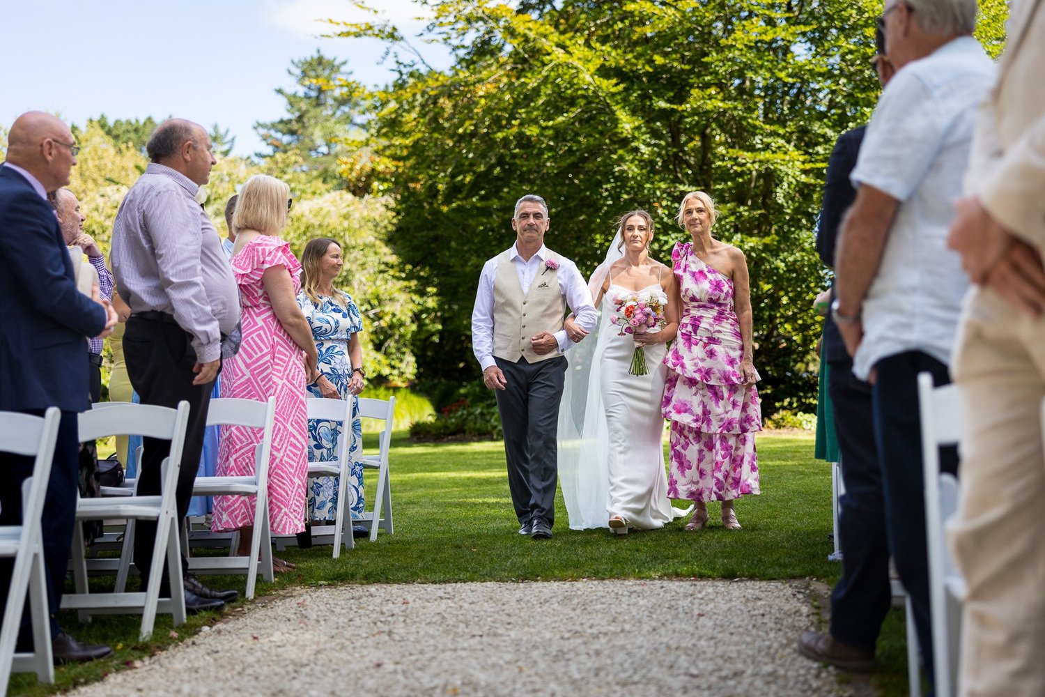 Jade walks down the aisle with her bridesmaids