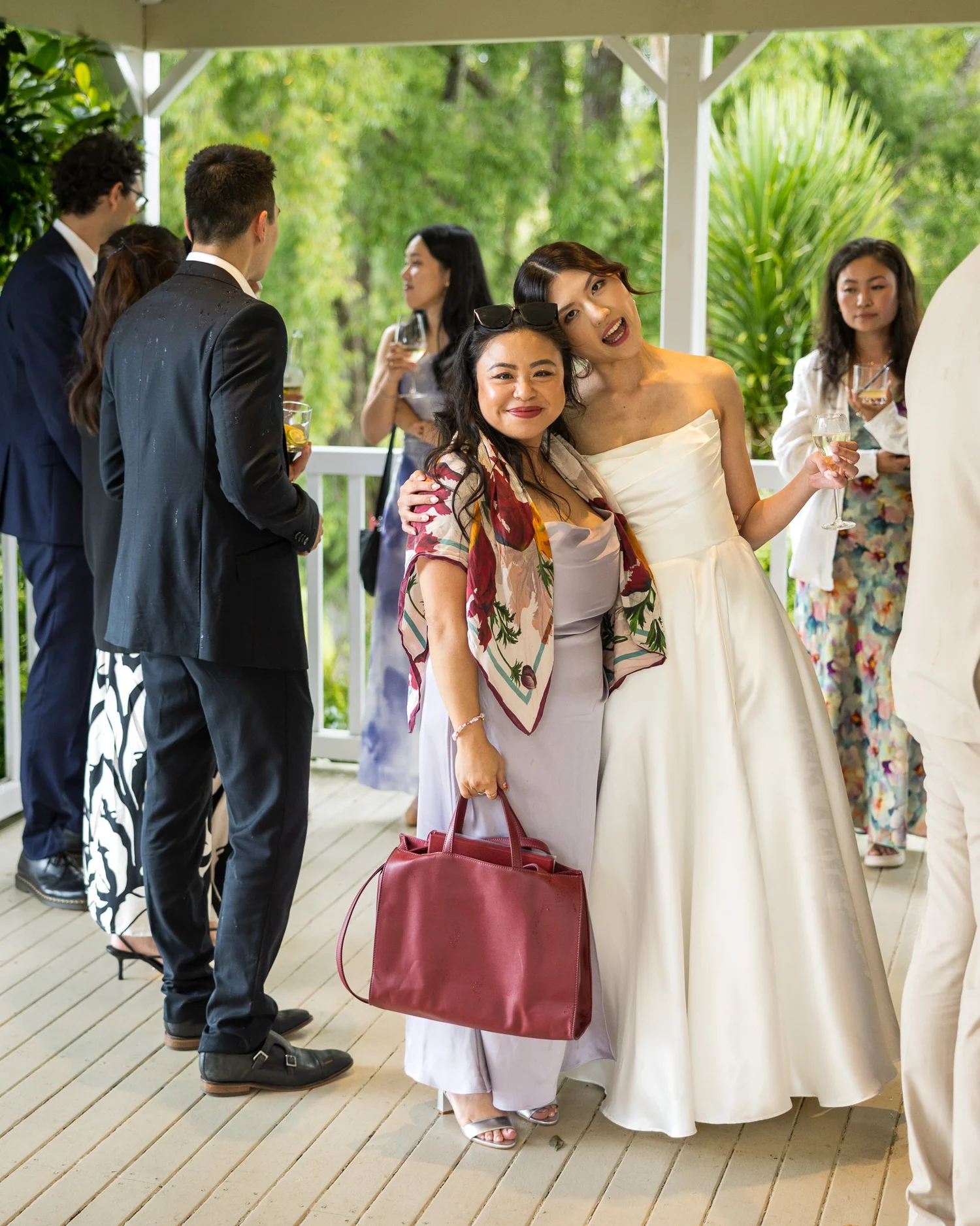 A bride chats with guests after the ceremony
