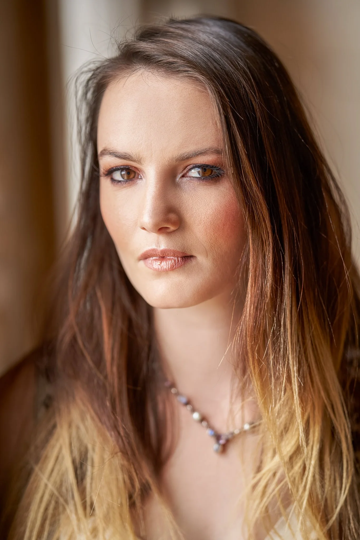 Close portrait of a woman with long ombre hair