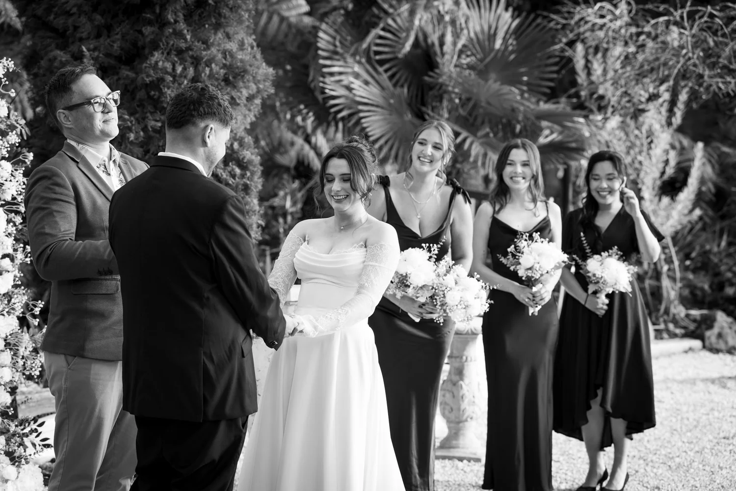 Black and white photo of the ceremony with the bridesmaids