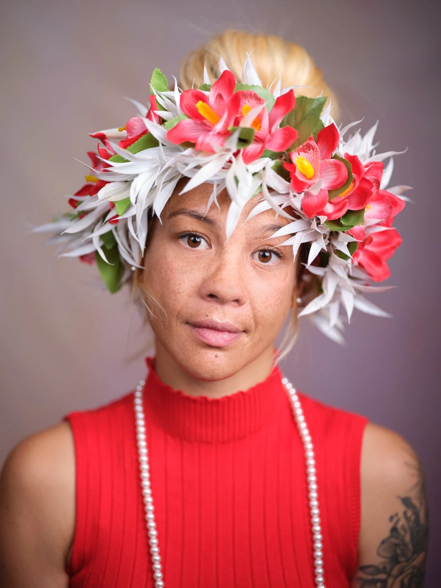 A woman wearing a vibrant floral crown