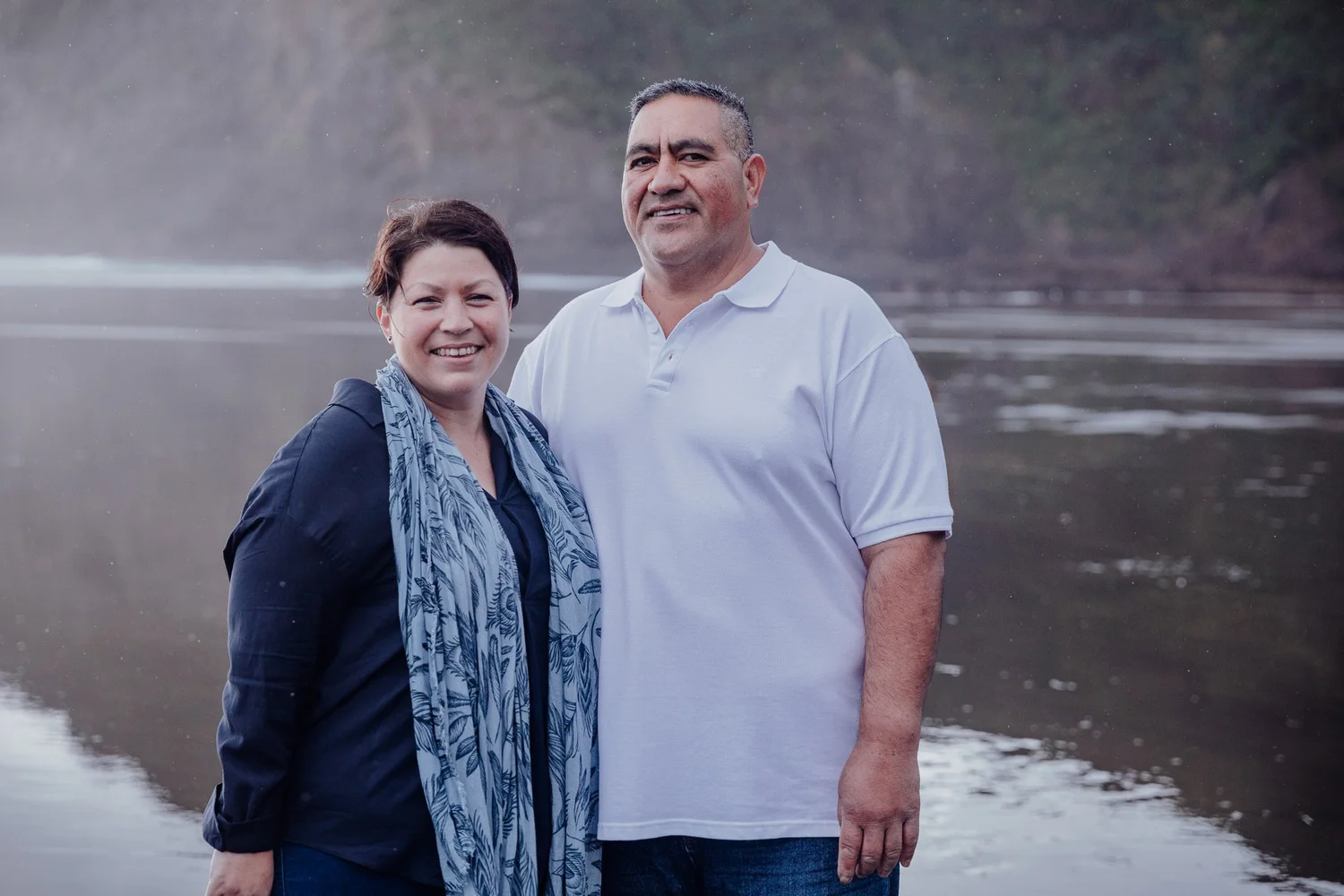 A couple standing together on the beach
