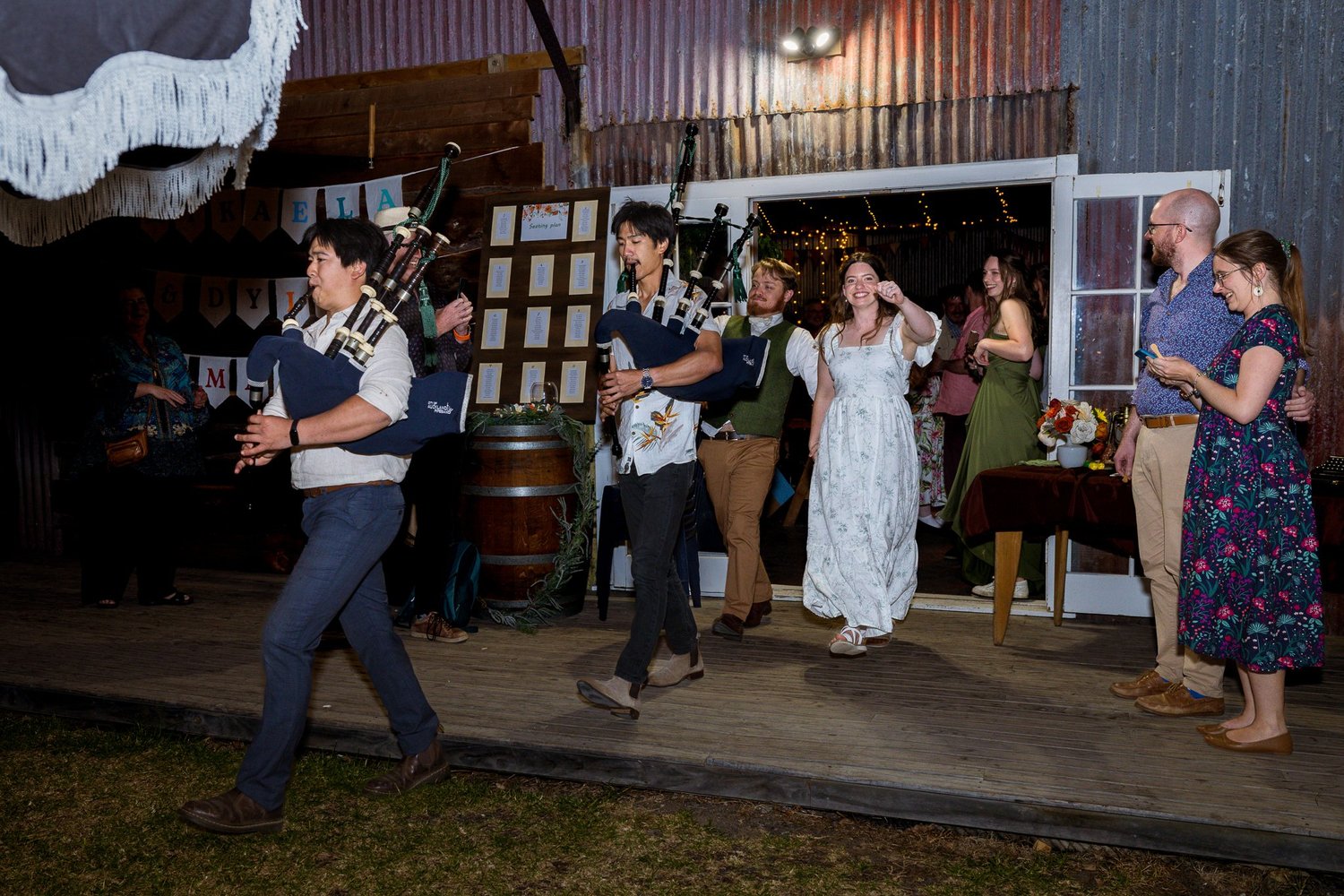 A piper leads guests into the reception