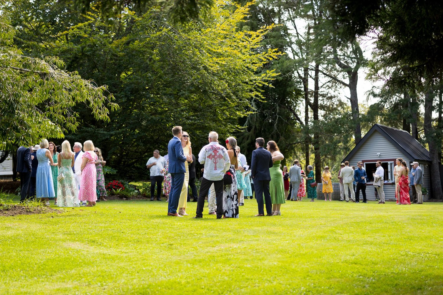 Guests mingle on the lawn after the ceremony