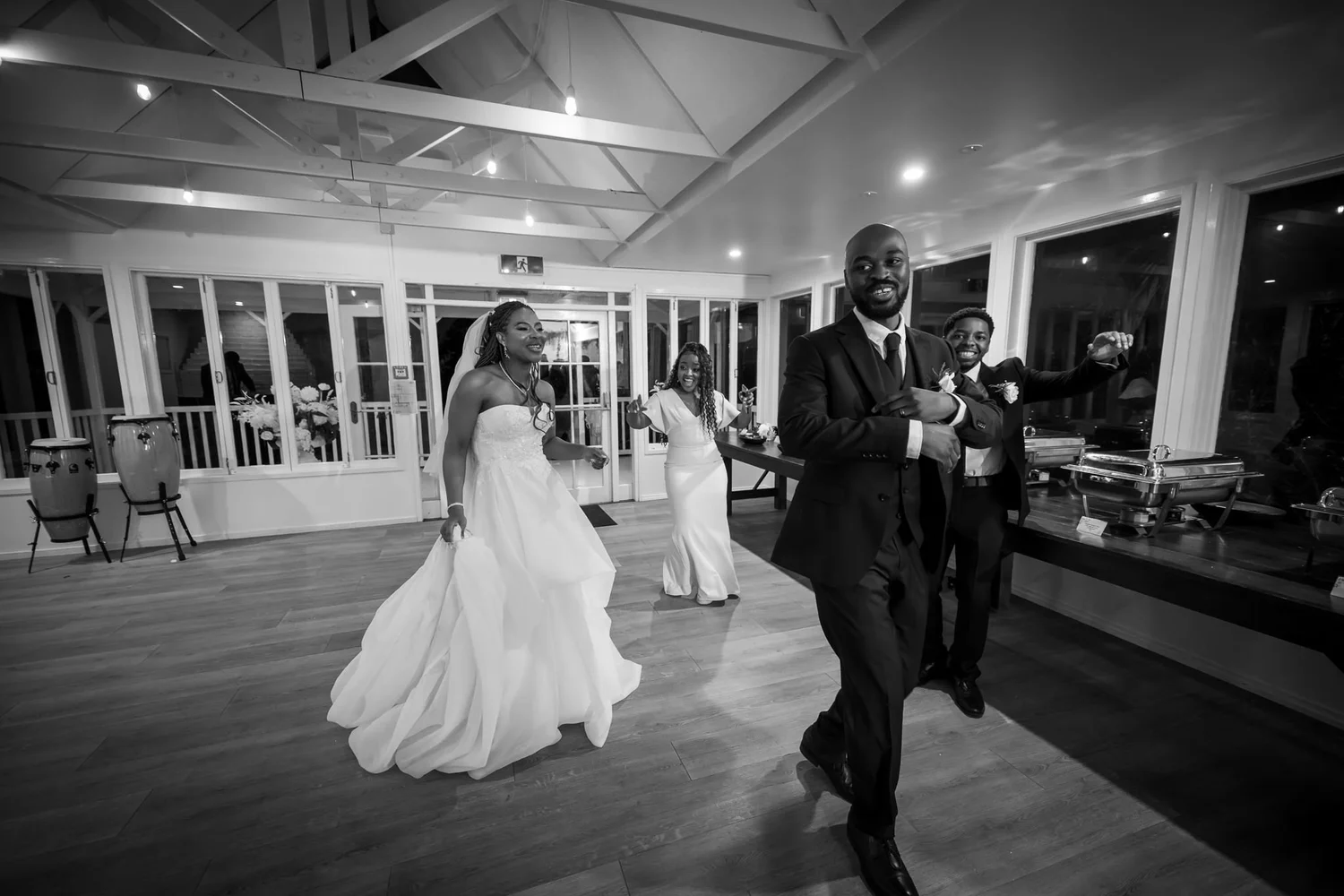 Black and white photo of the couple dancing into the reception