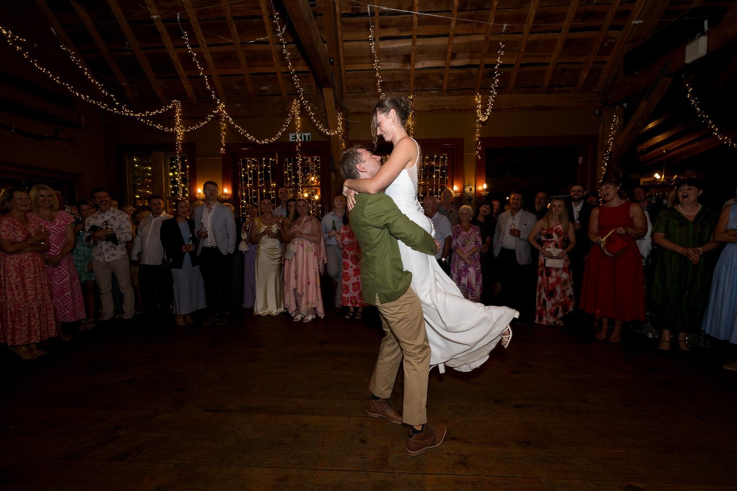 Ben lifts Jade during their first dance in the barn