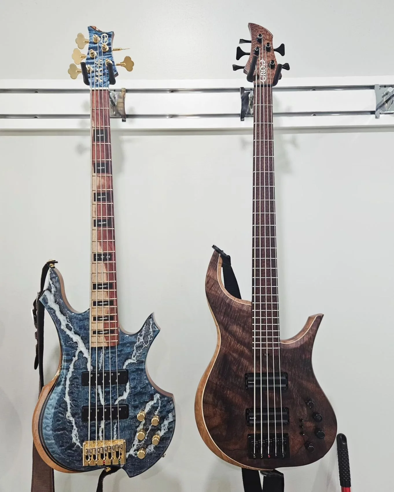 The old and the new. The Zeus bass is back in the shop for some adjustments, and I had to take a picture of it next to the new Mammoth Bass. You can definitely tell I have a build style. It's always fun to see old builds and compare how I used to do 