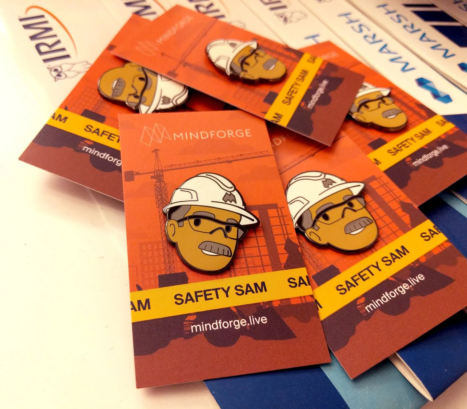 Simplified company mascot "Safety Sam" into vector form to print as an enamel pin