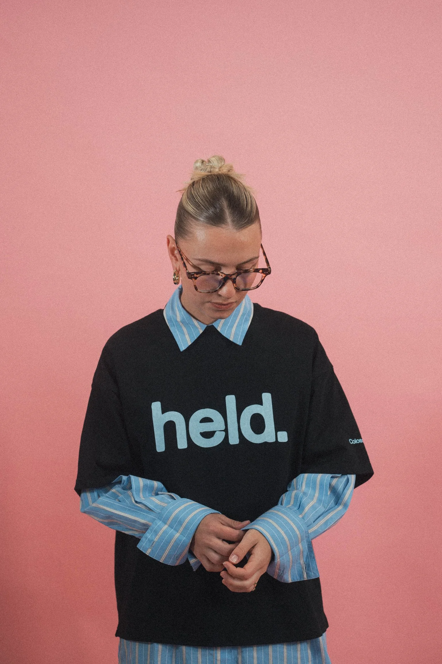 Model wearing the Held Christian streetwear tee by Emunah Yahweh