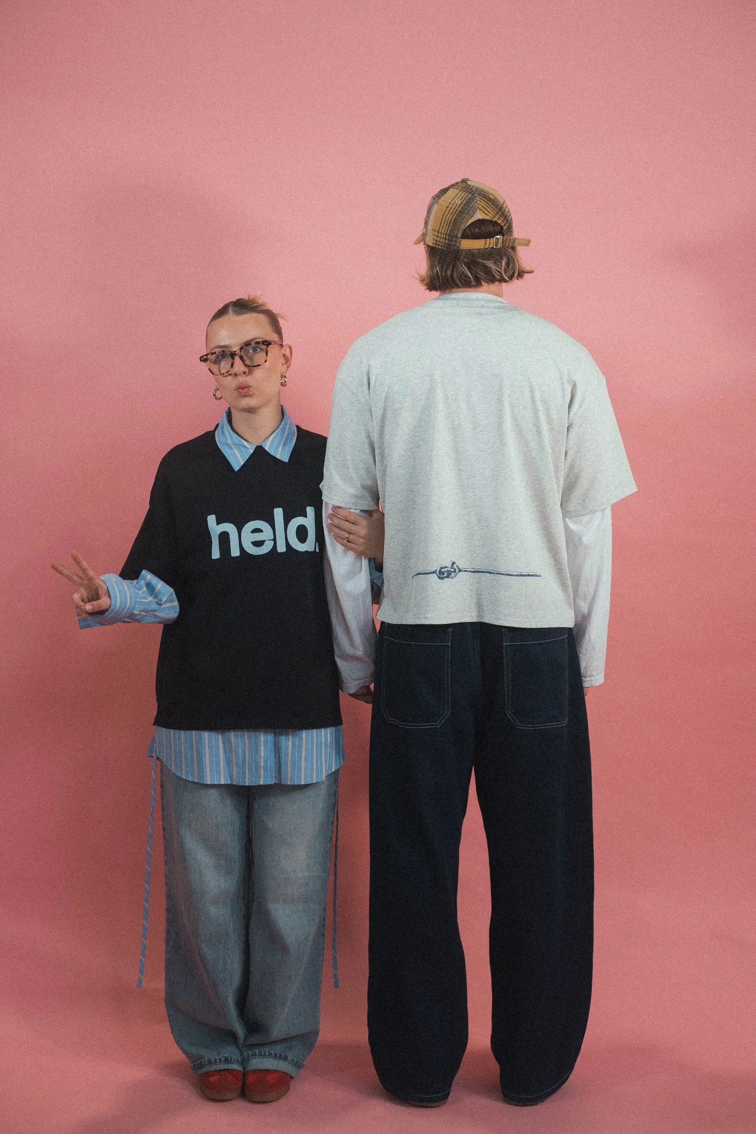 Model wearing the Held Christian streetwear tee by Emunah Yahweh