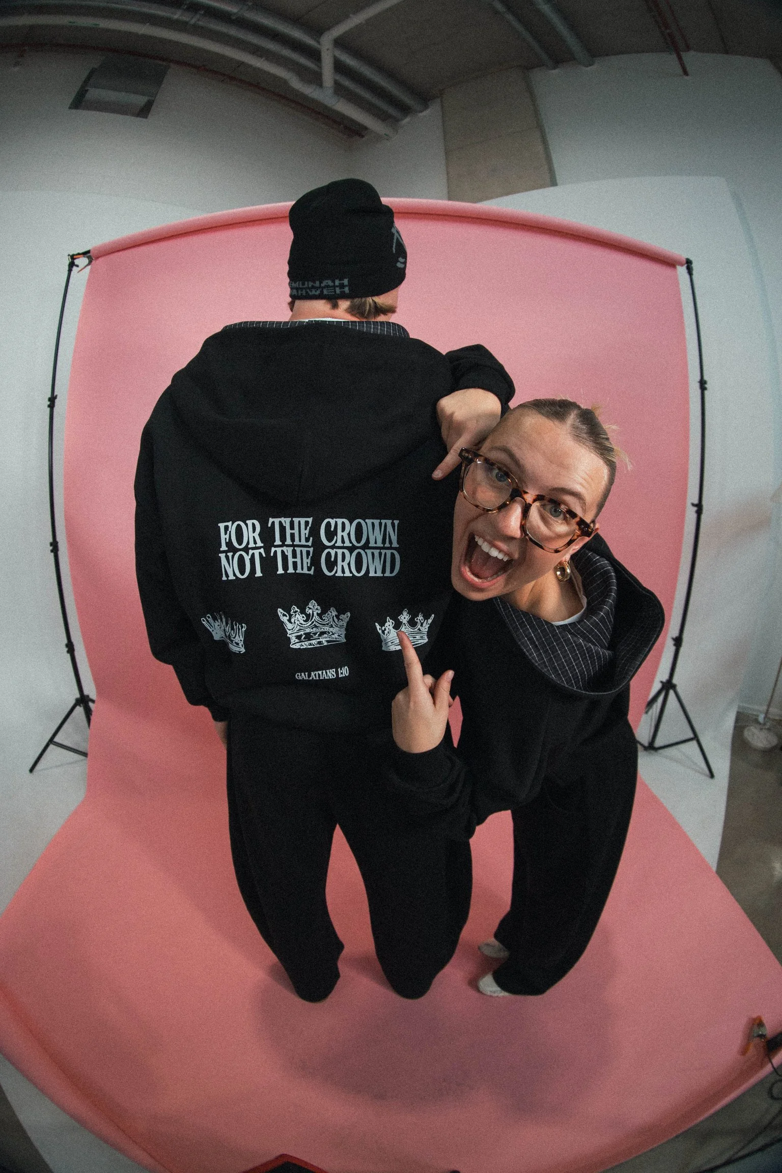 Model wearing the For The Crown Christian streetwear tracksuit by Emunah Yahweh