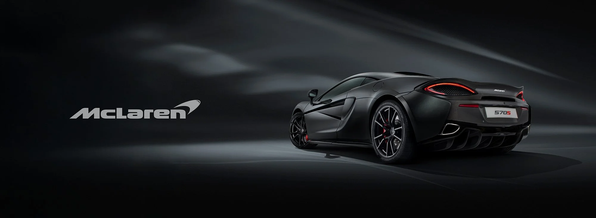 McLaren 570s rear side view car photography.