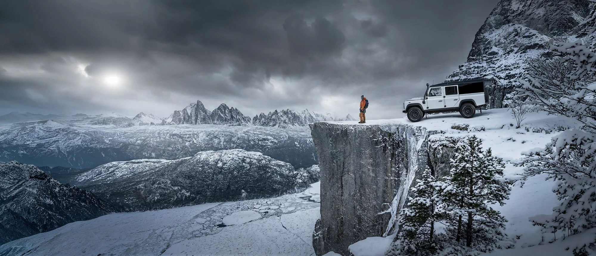Land Rover Defender in snowy Mountains