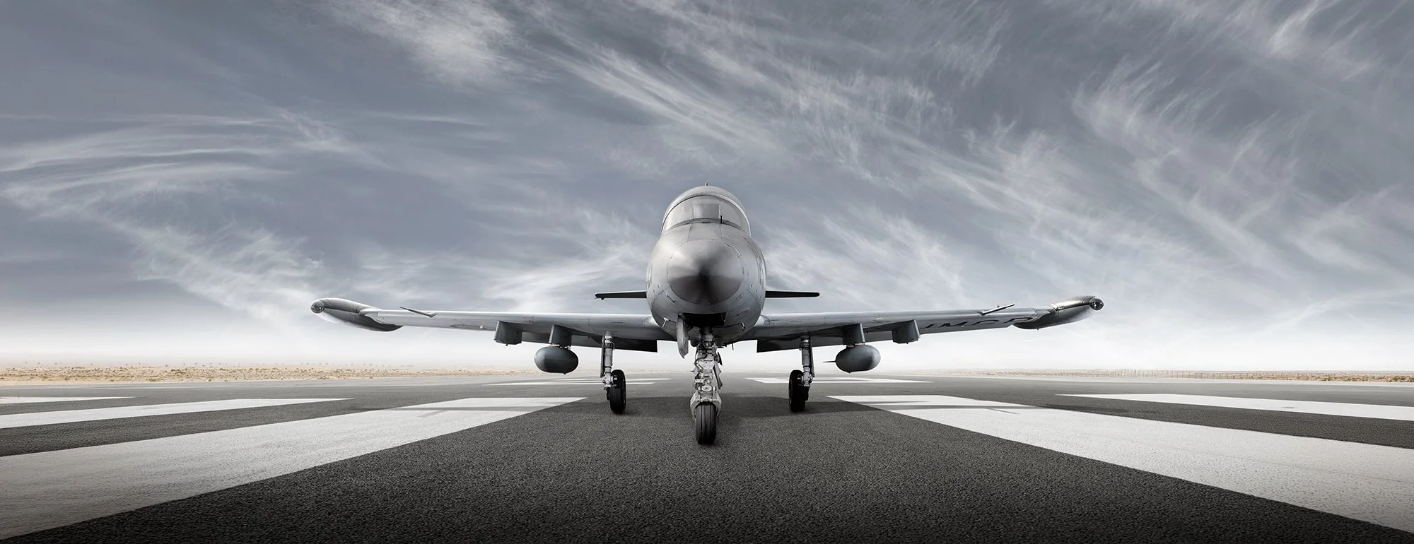 L-39 Jet aircraft on runway, front view, aviation photography.