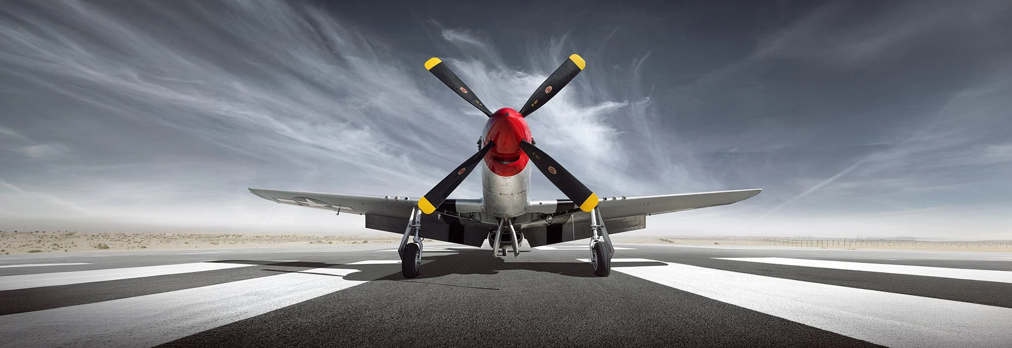 P51 Mustang aircraft on runway.