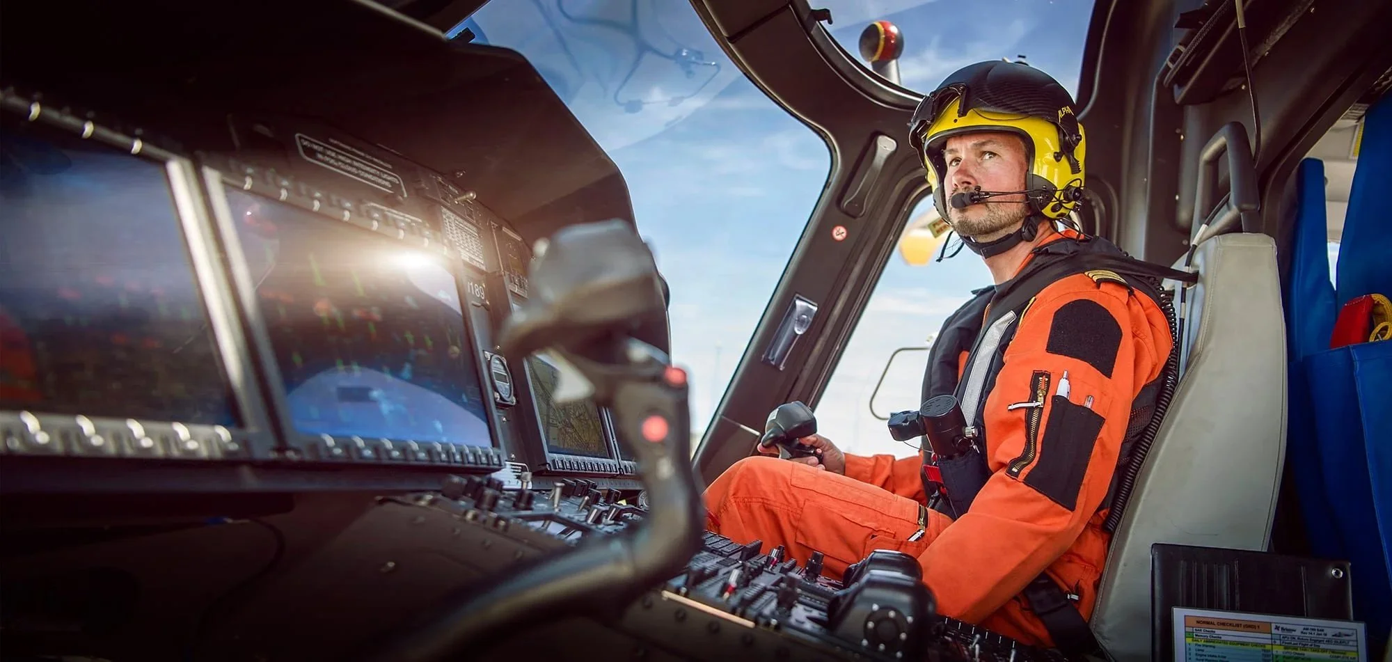 Helicopter pilot in cockpit of aircraft, aviation photography
