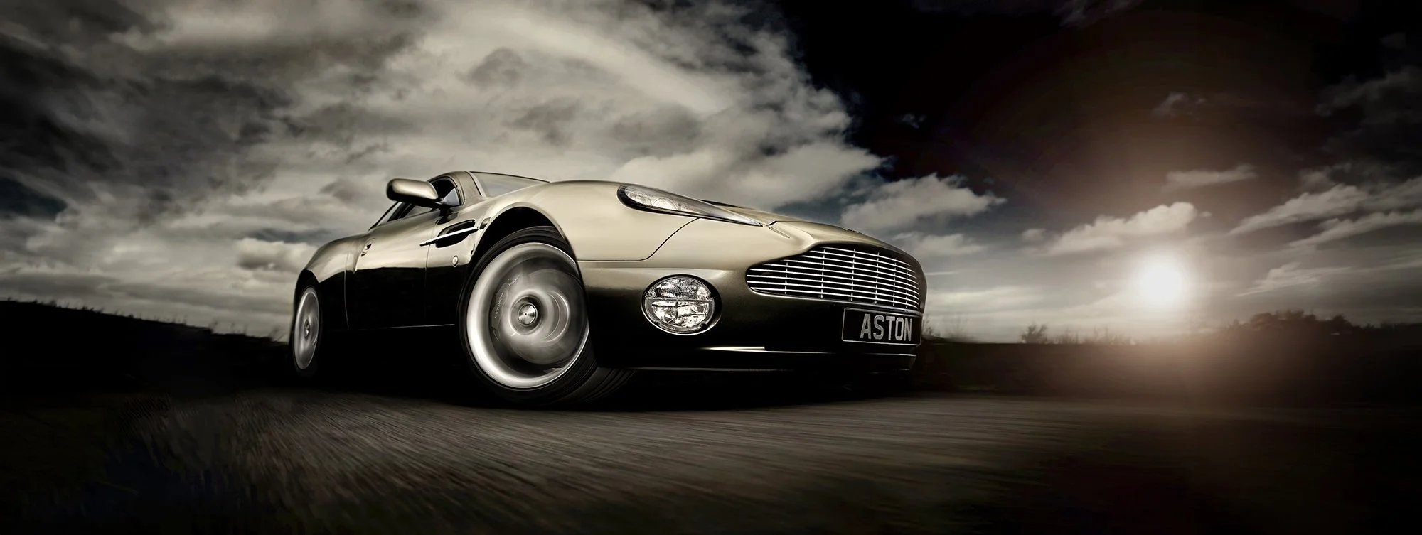 Aston Martin Vanquish low angle showing motion of car.
