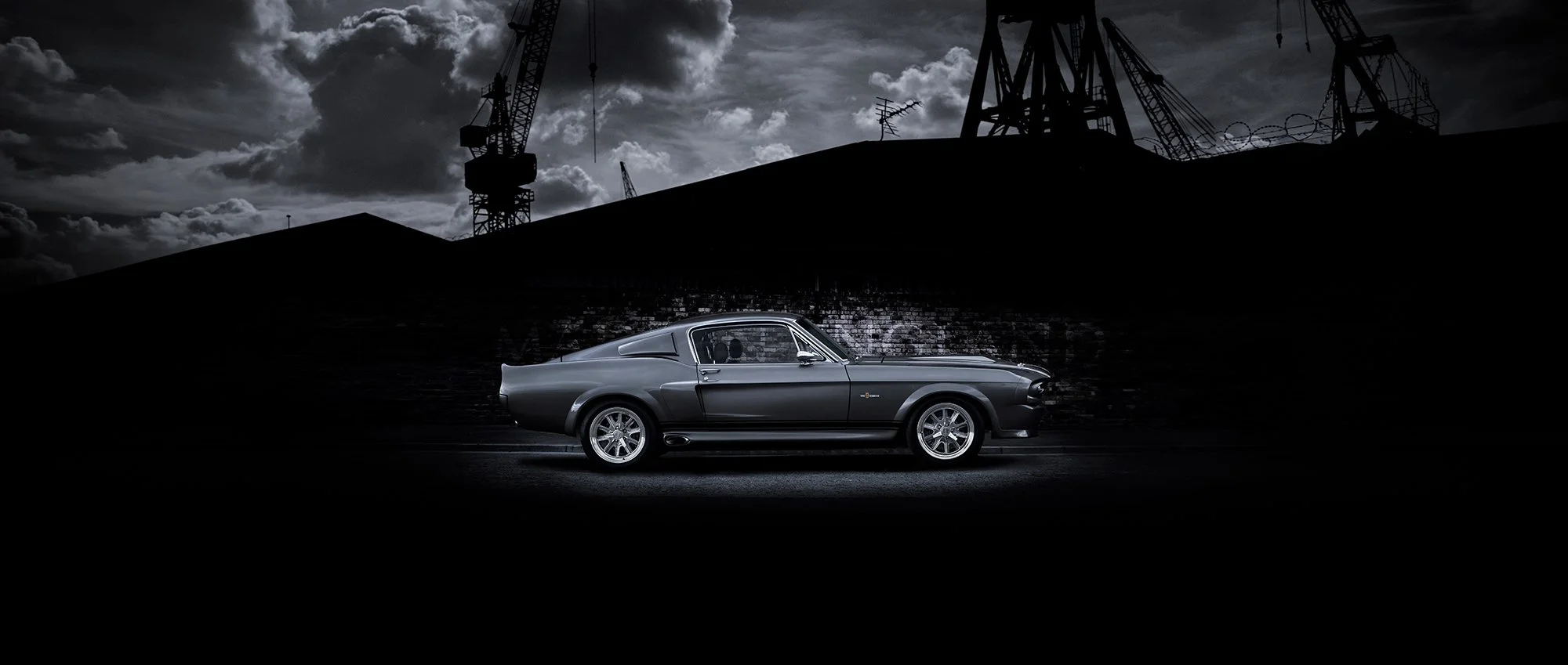 Shelby GT500 car profile view with moody dark sky