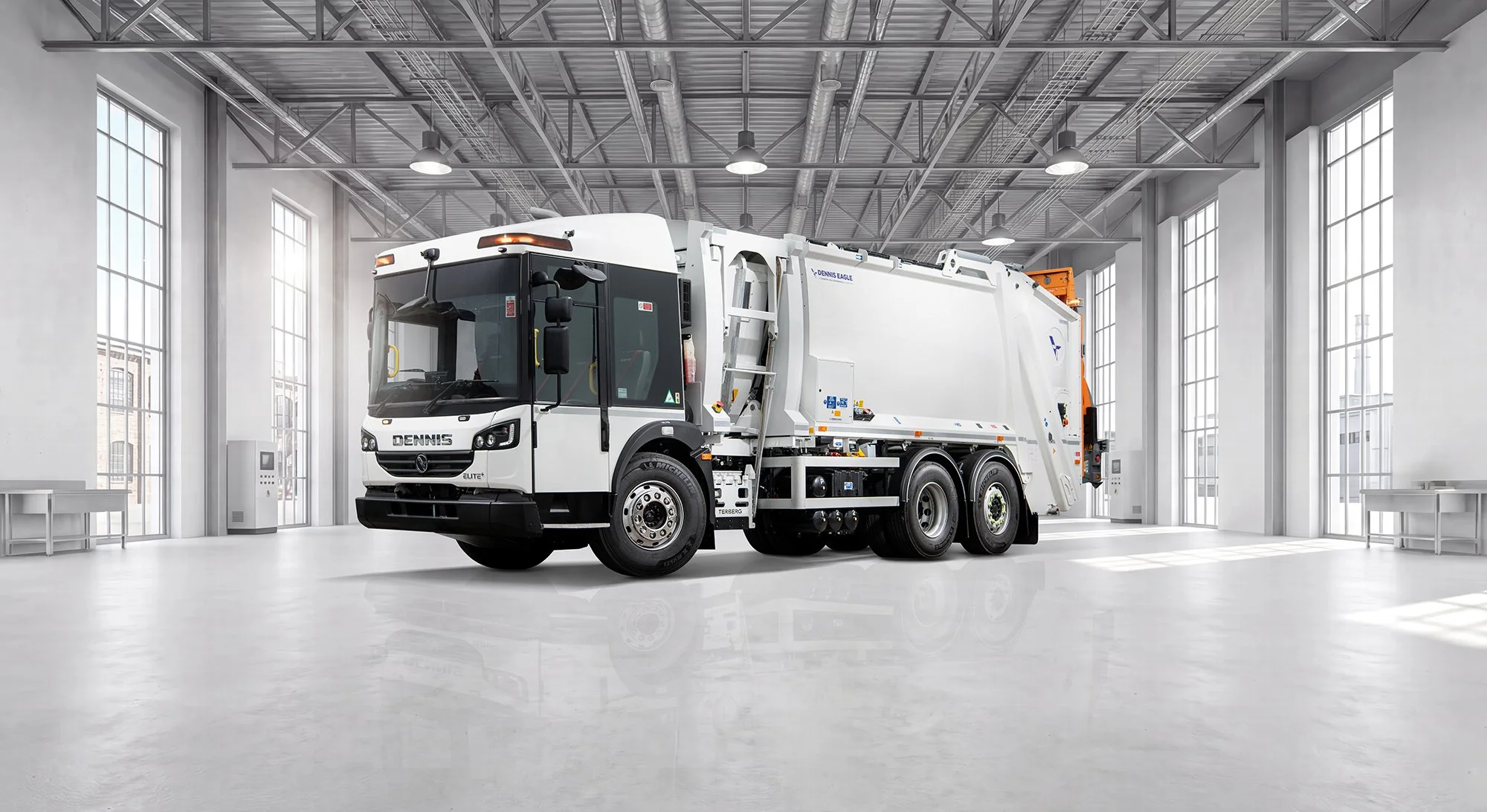 Dennis Eagle truck in clean white factory space.