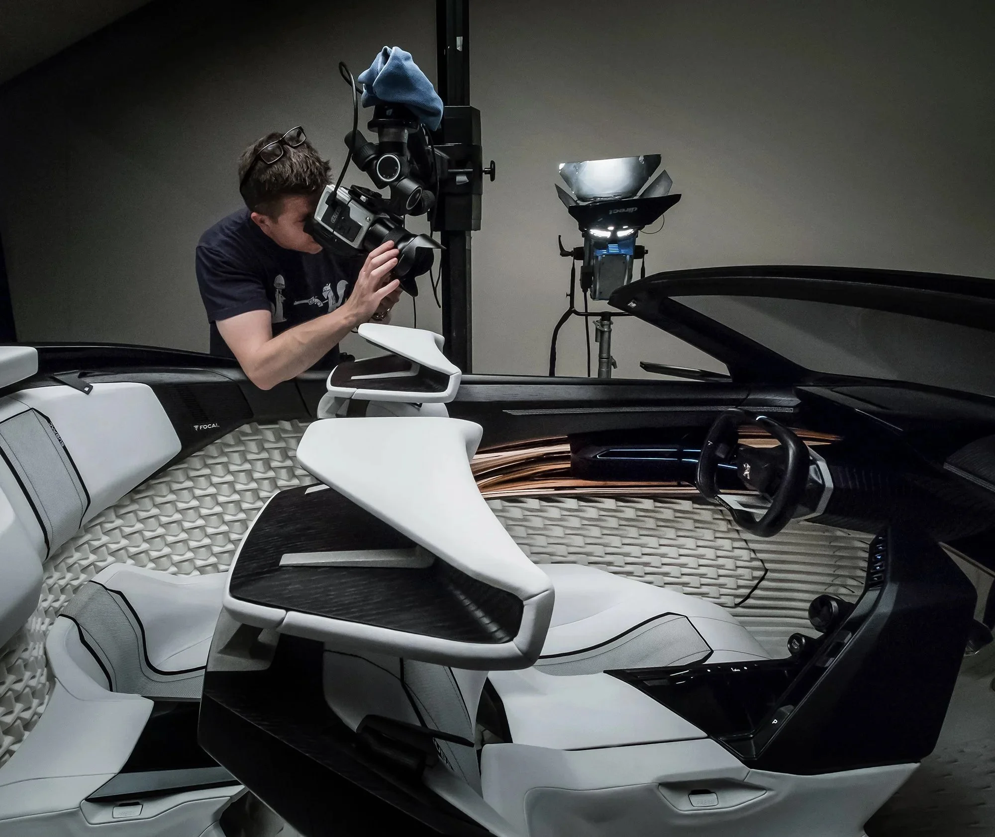 Car Photographer Tim Wallace seen behind the scenes working in studio photographing a car.