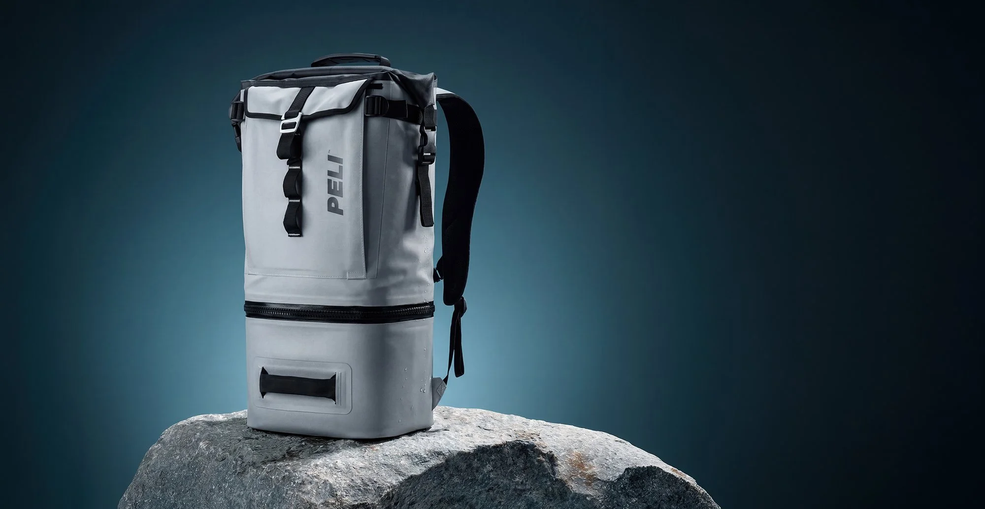 Grey backpack on stone block 