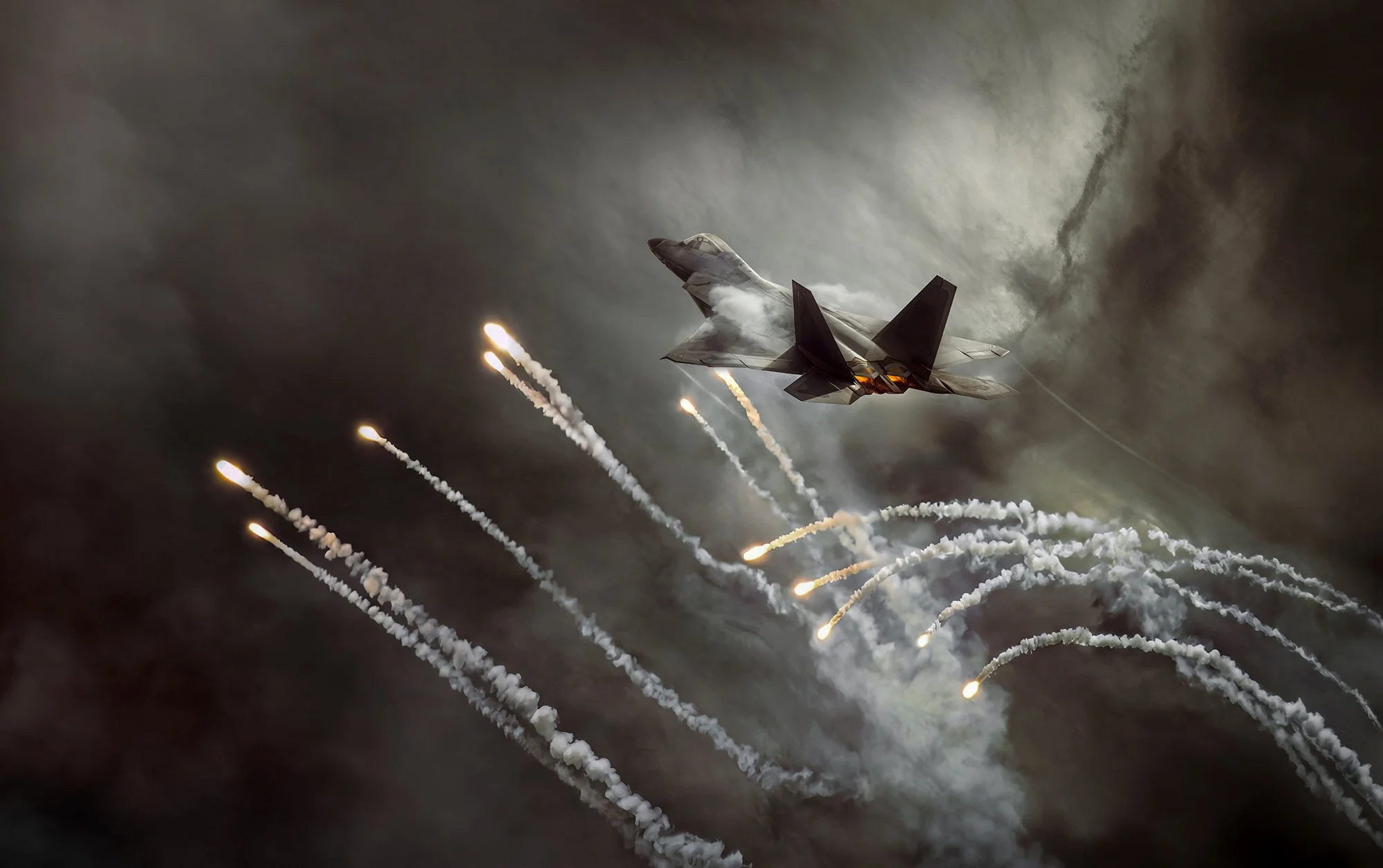 F22 Raptor in flight releasing counter measures flares.