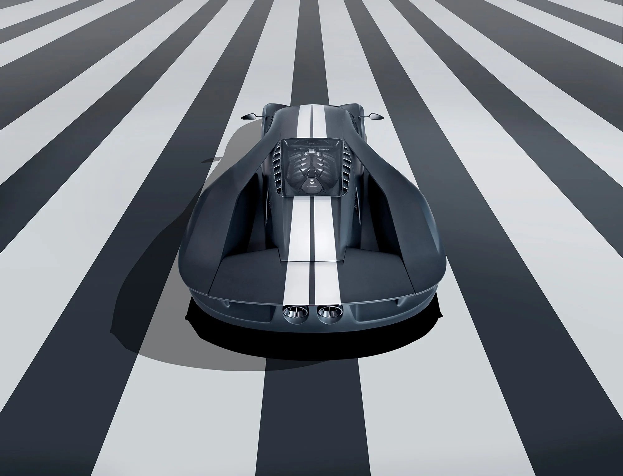 Ford GT car on a stripped floor, rear view.