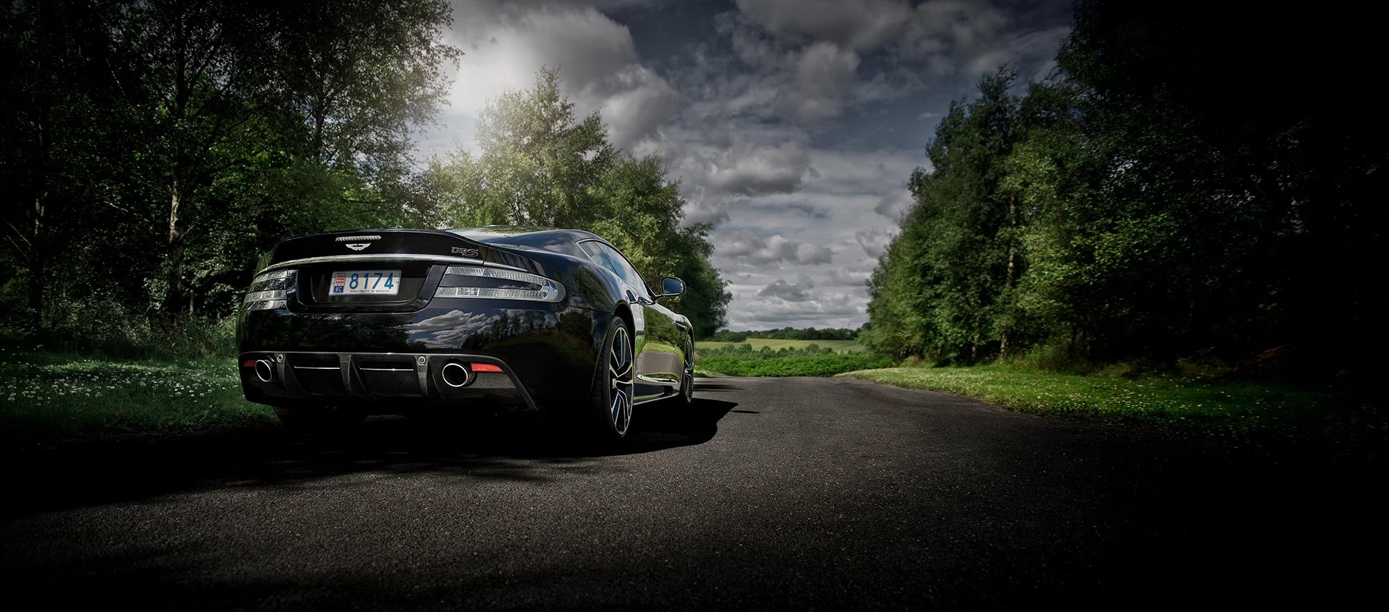 Aston Martin DBS, Rear view on Country Road.
