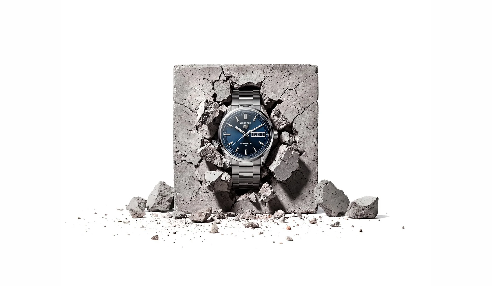 Watch breaking out of stone block
