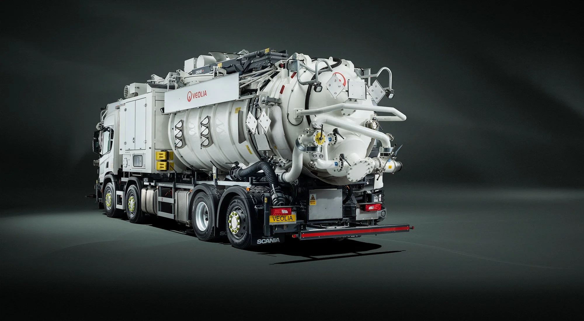 Rear view of large white DiSab tanker photographed in studio.