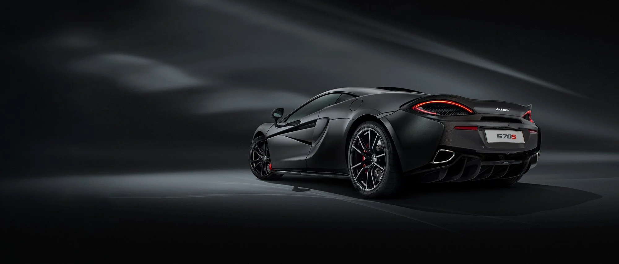 McLaren 570s rear side view car photography.