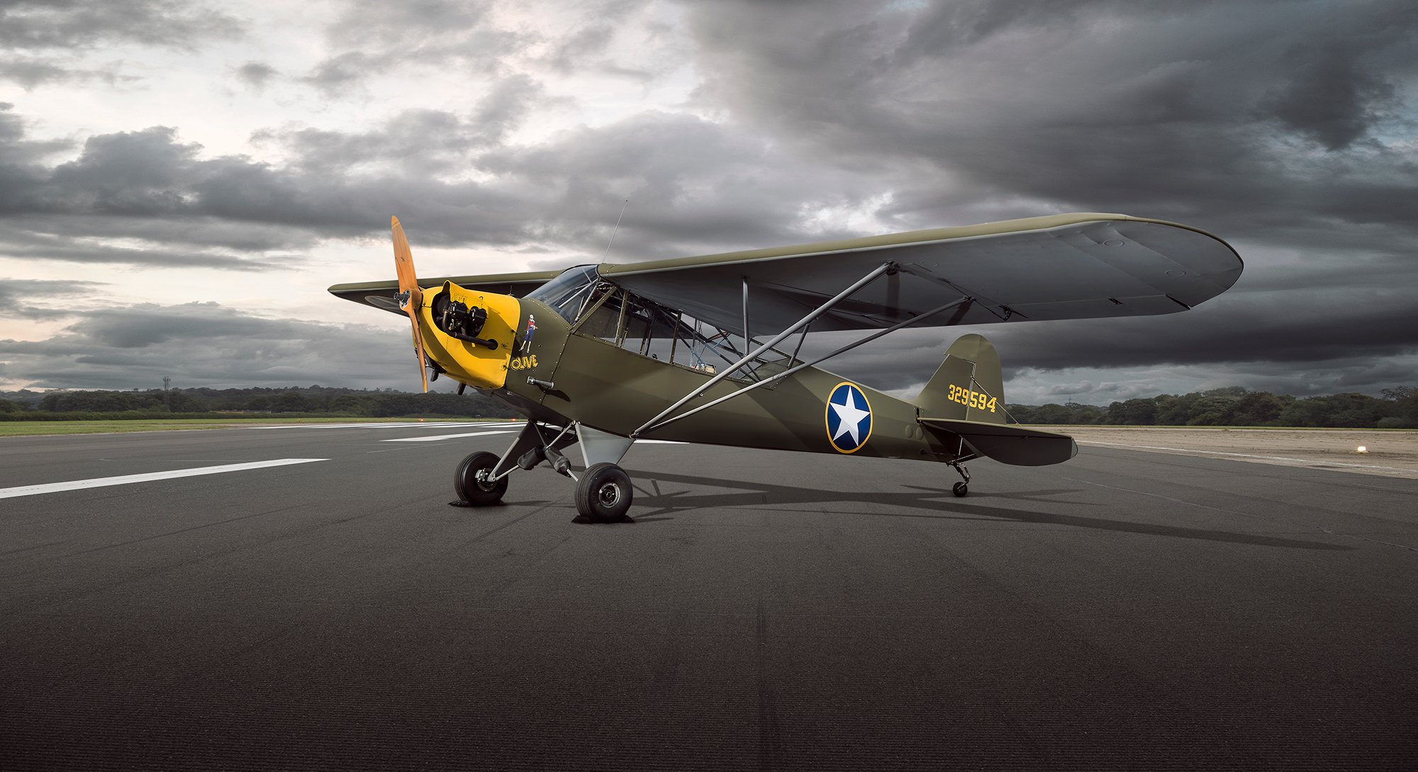 Vintage Aircraft - Piper L4 Cub on open runway
