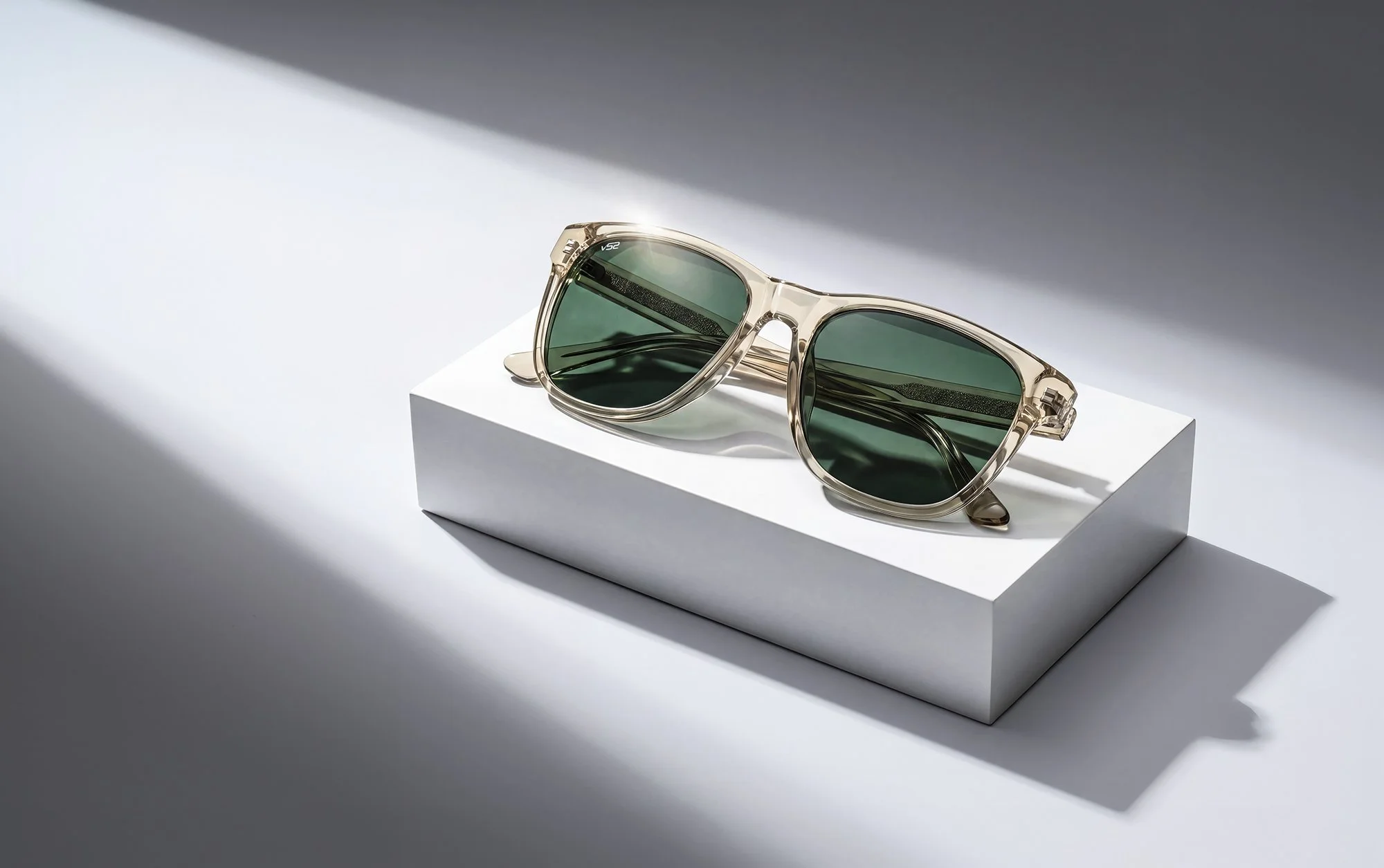 Green sunglasses on white background.