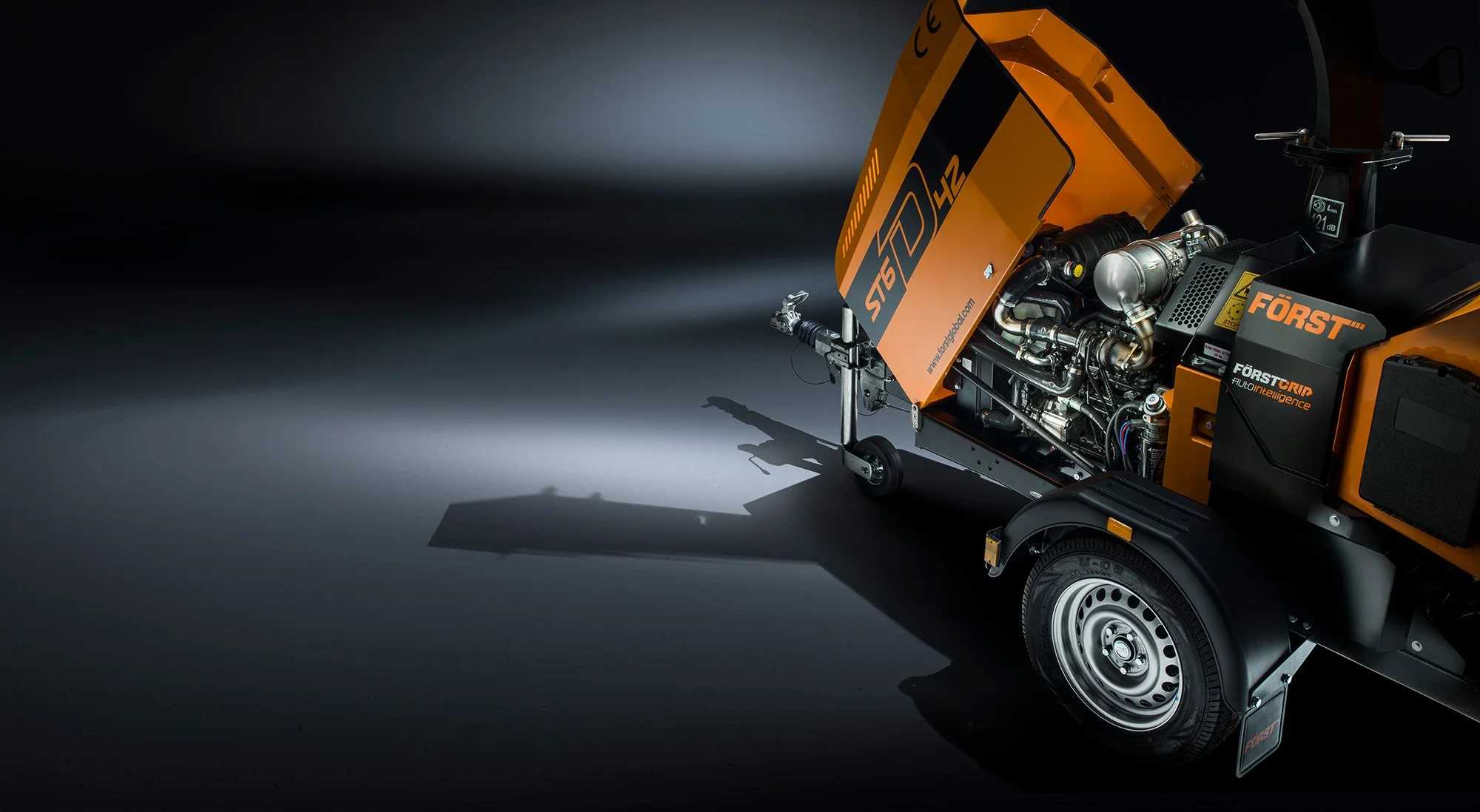 Dramatic photography in studio of a wood chipper by Tim Wallace
