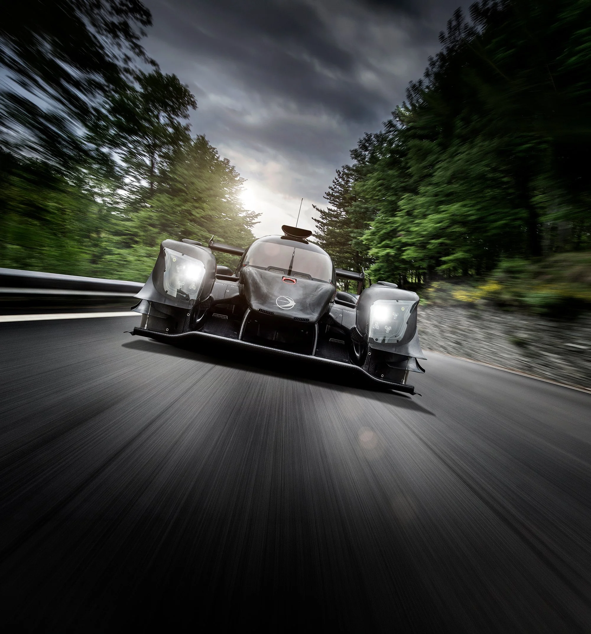 Le Mans race car driving fast towards camera, car photography Tim Wallace. 