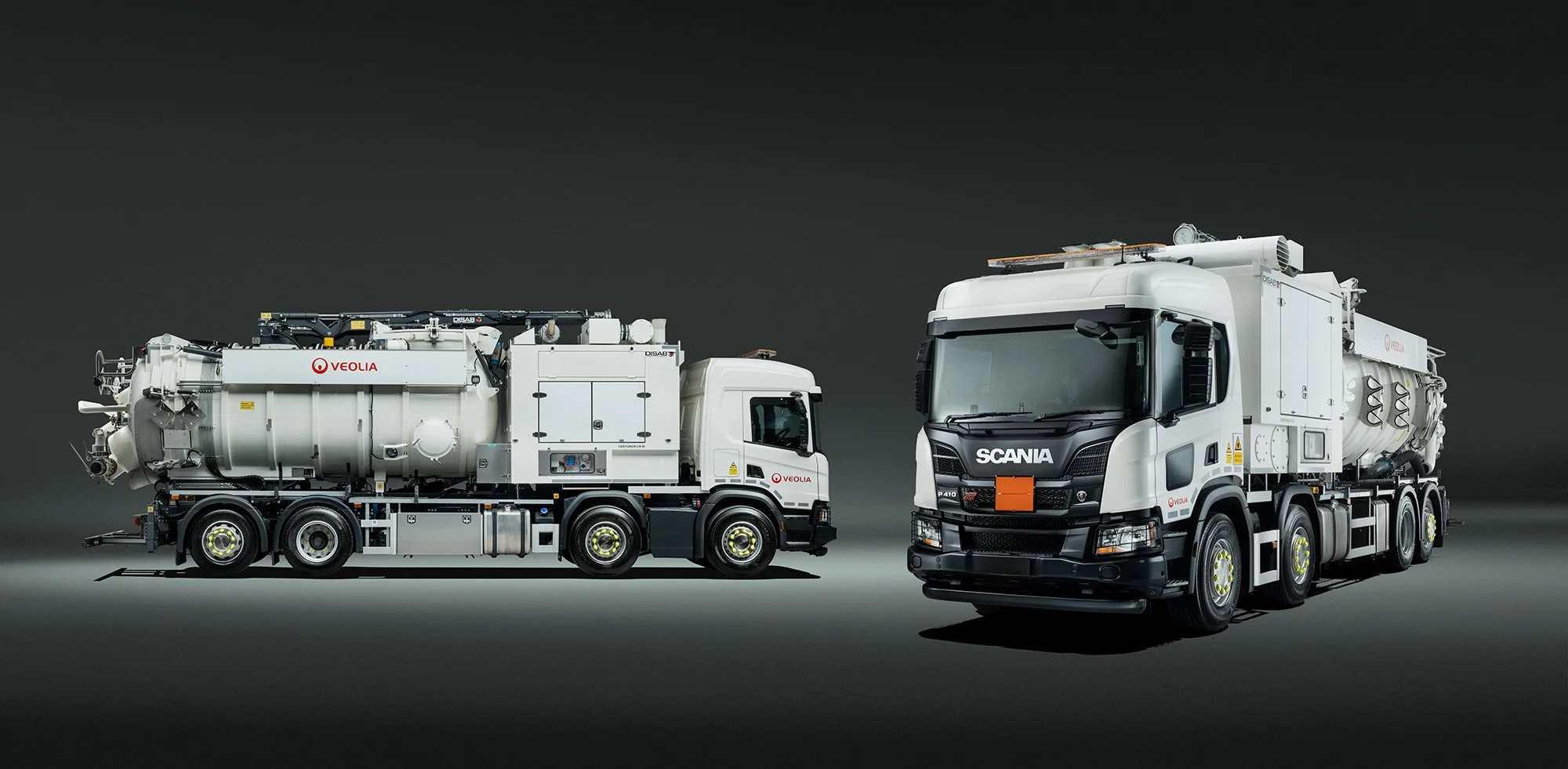 2 large white DiSab trucks photographed in studio by photographer Tim Wallace.