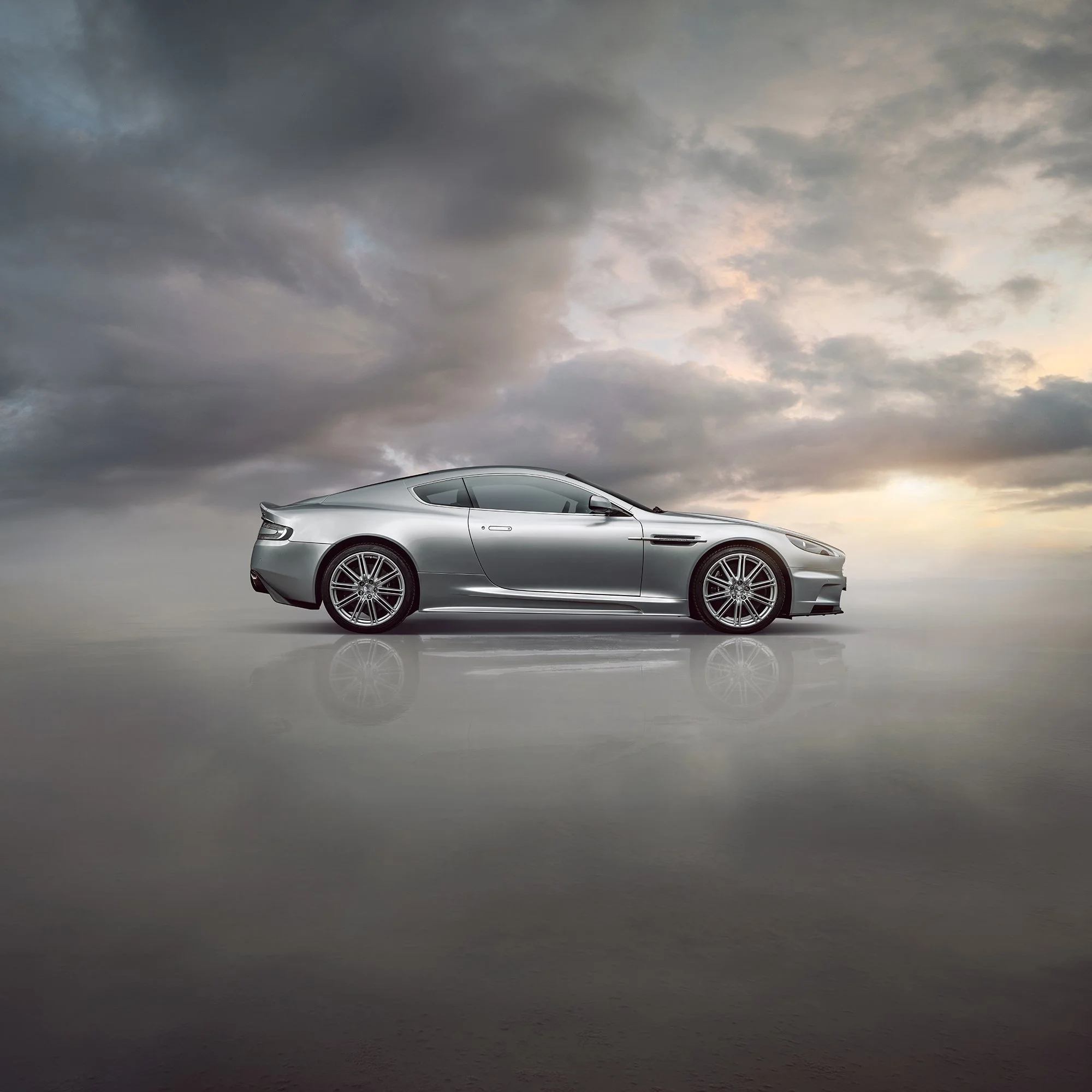 Side profile view car photography of an Aston Martin DBS V12.