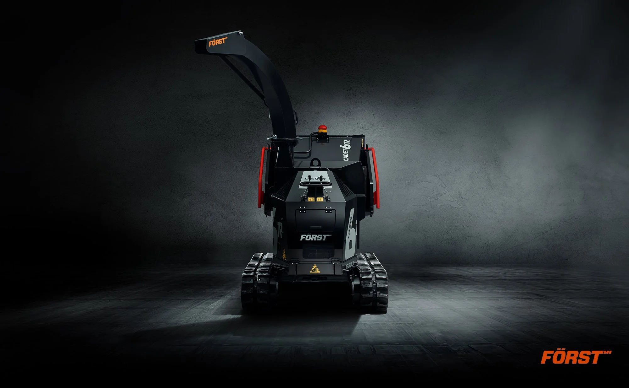 Black coloured Forst wood chipper with tracks.