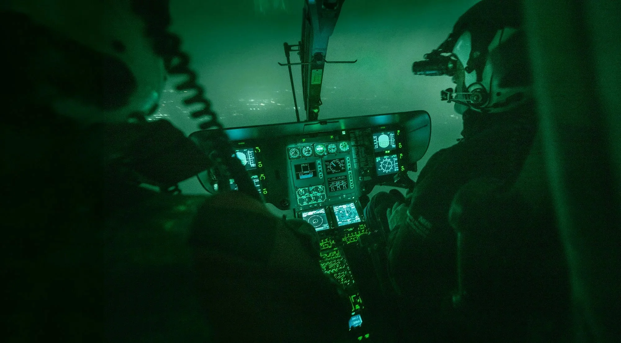 Air Ambulance pilot flying at night with night vision.