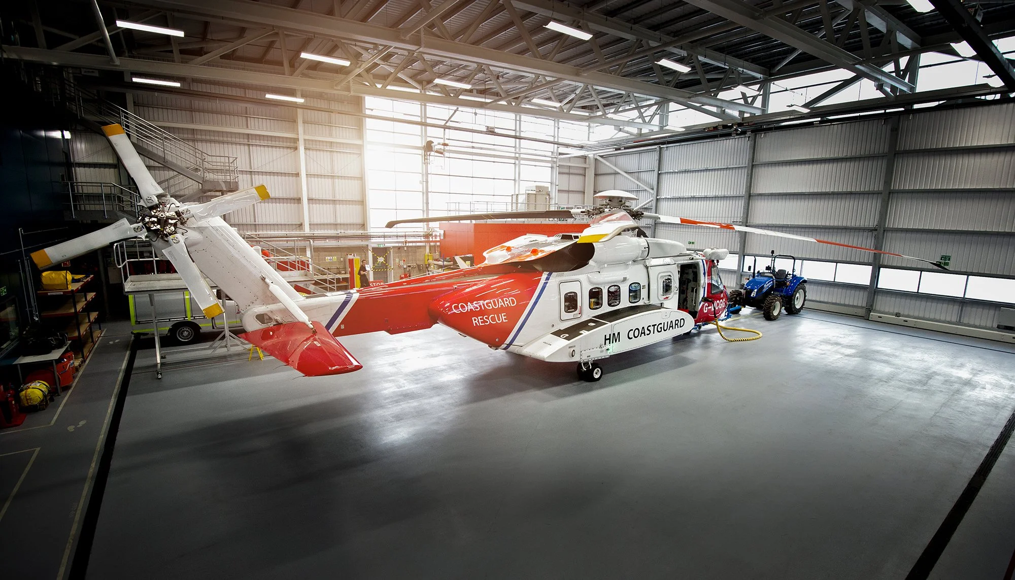HM Coastguard Search and Rescue helicopter in hanger.