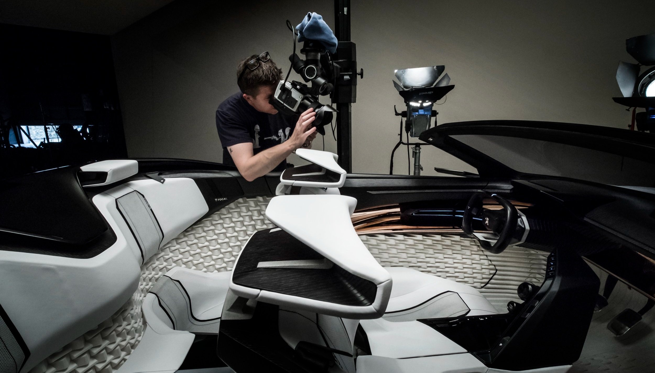 Photographer Tim Wallace working in studio shooting a car interior.