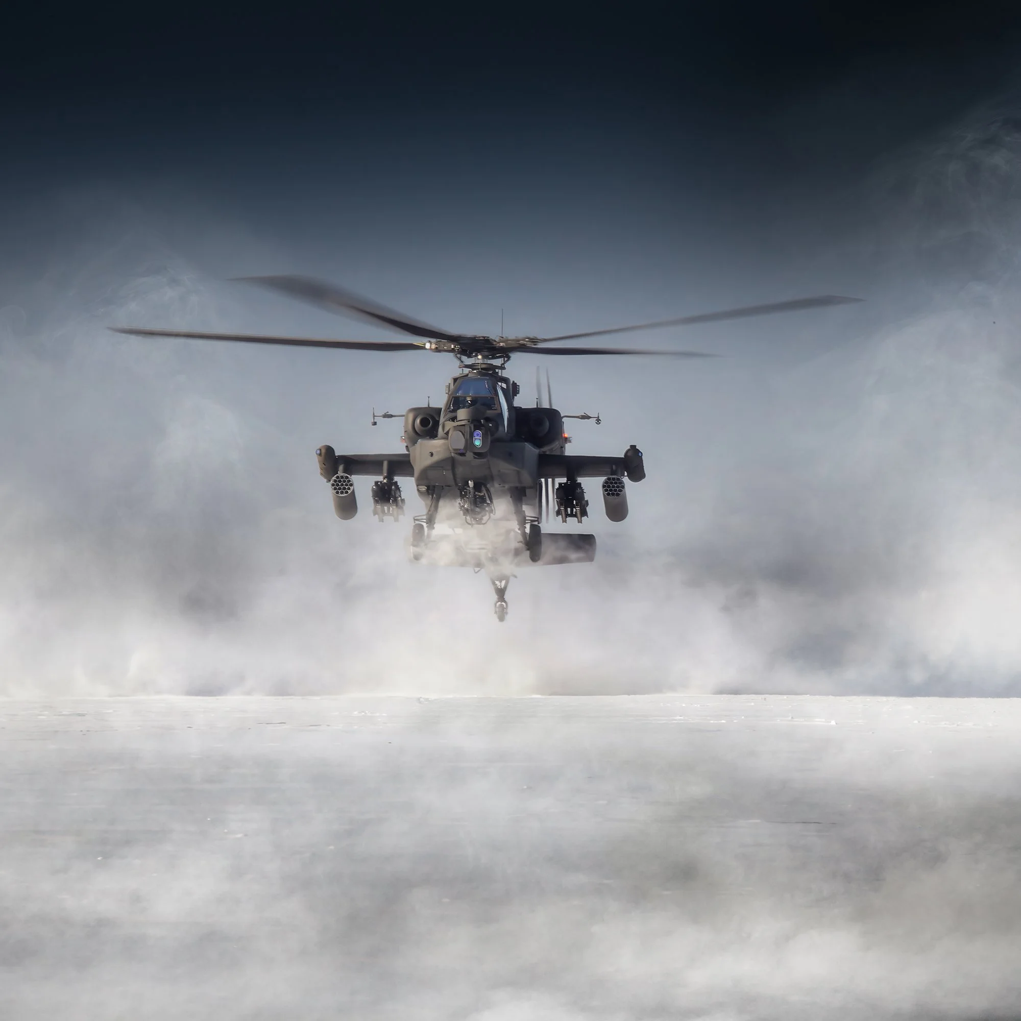 Attack helicopter landing on snow covered land