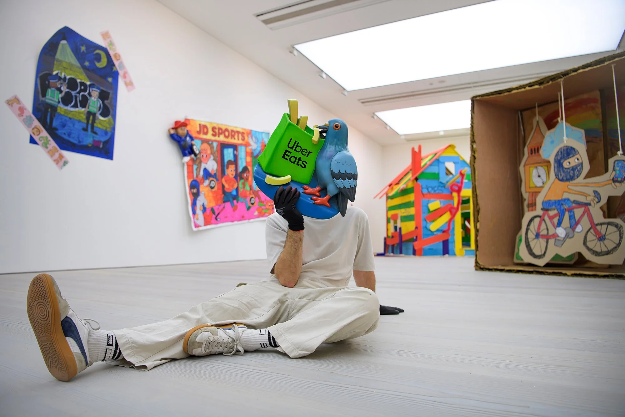 The artist 'Priest' pictured in his London exhibition