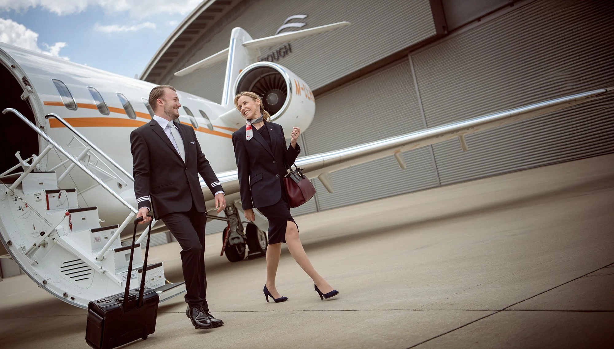 Aircrew walking away from private jet at airport